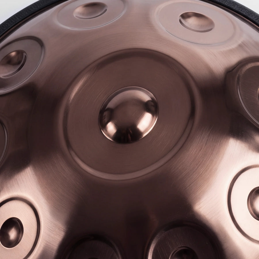 Close view of the central ding on a Sonant D Kurd handpan with 10 notes in a bronze finish — 17