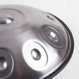 Close view of a Sonant D Kurd handpan with 10 notes in a silver finish, showing its tone fields and rim — 3