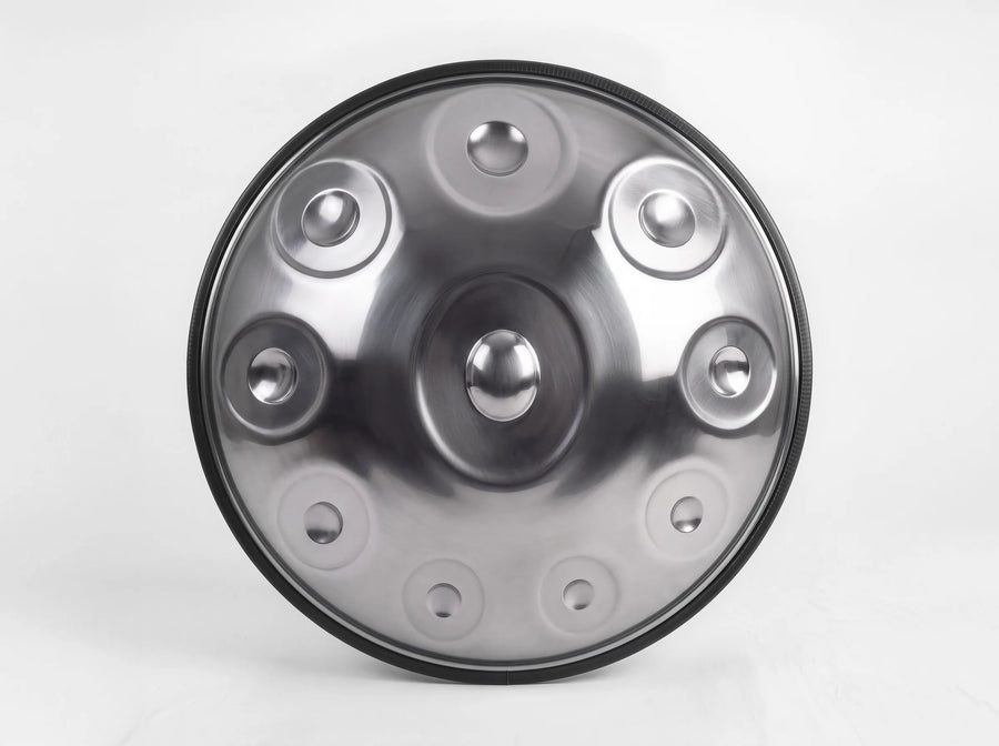 Front view of a brushed stainless steel handpan with 10 notes, showing its central dome and 9 surrounding notes