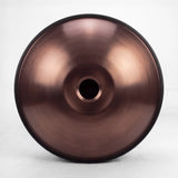 Underside of a Sonant D Kurd handpan with 12 notes in a bronze finish, showing its central opening and rim — 4