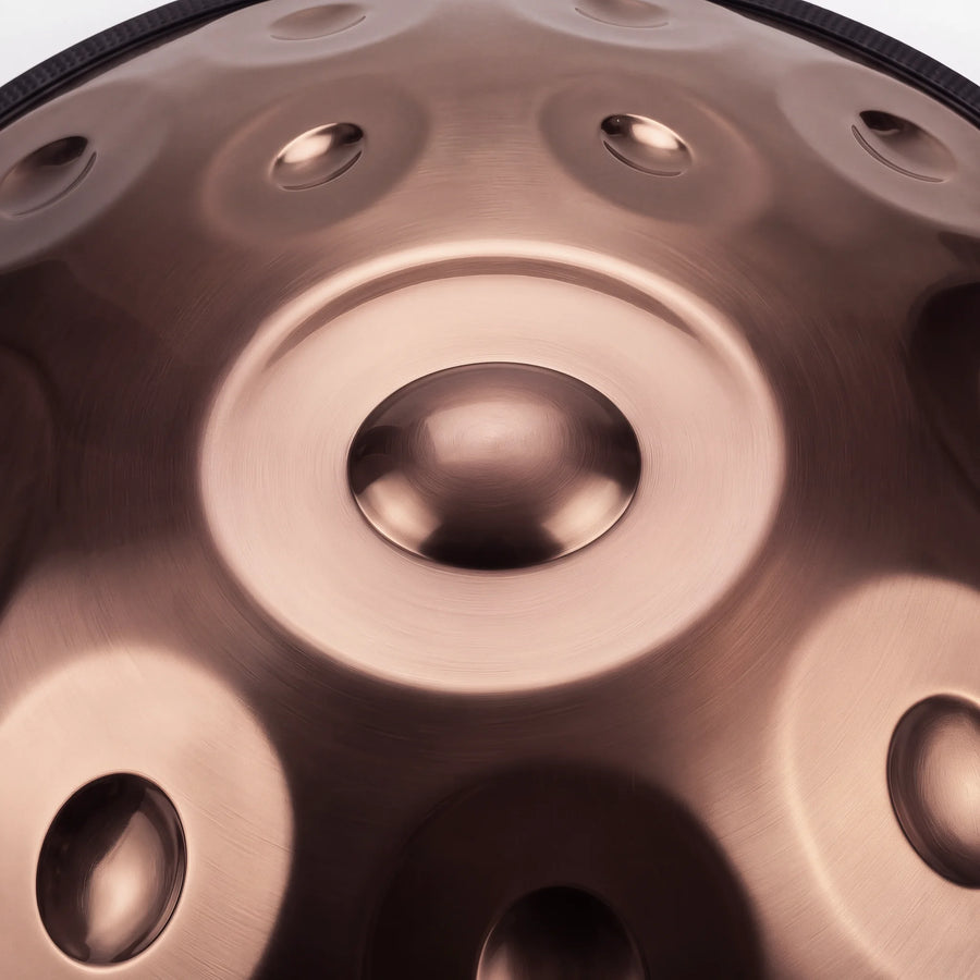 Close view of the central ding on a Sonant D Kurd handpan with 12 notes in a bronze finish — 5