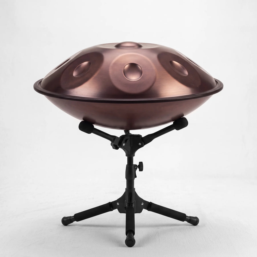 Sonant D Kurd handpan with 12 notes in a bronze finish on its folding stand — 6