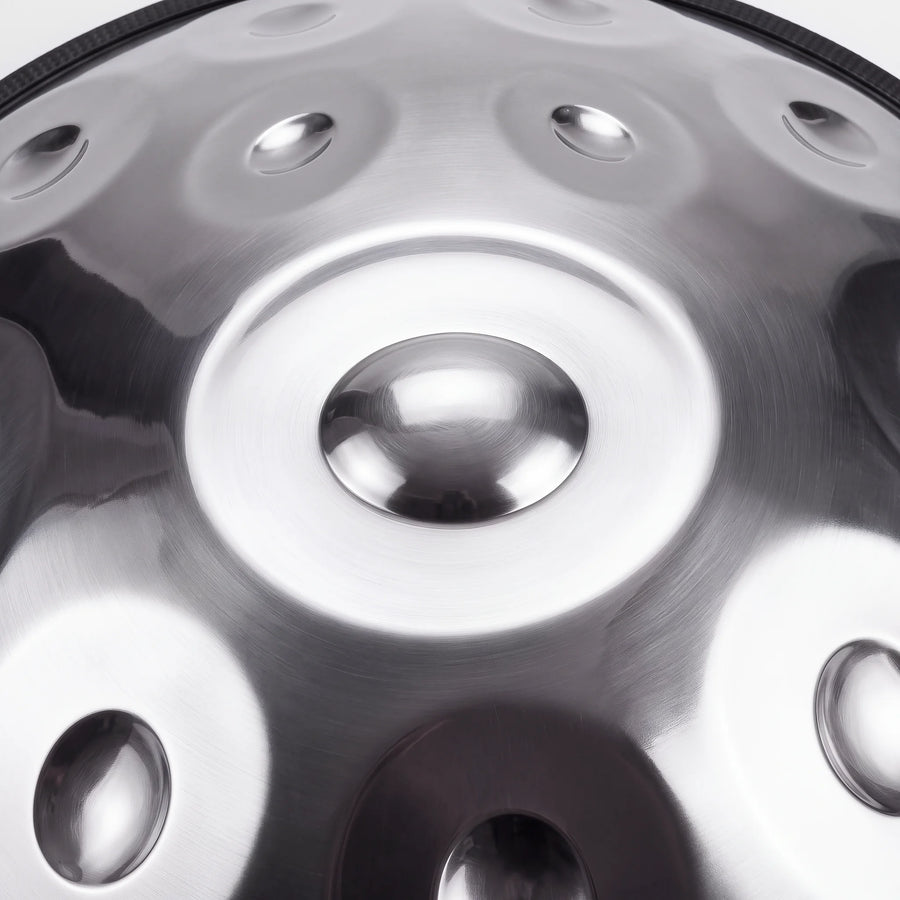 Close view of the central ding on a Sonant D Kurd handpan with 12 notes in a silver finish — 11