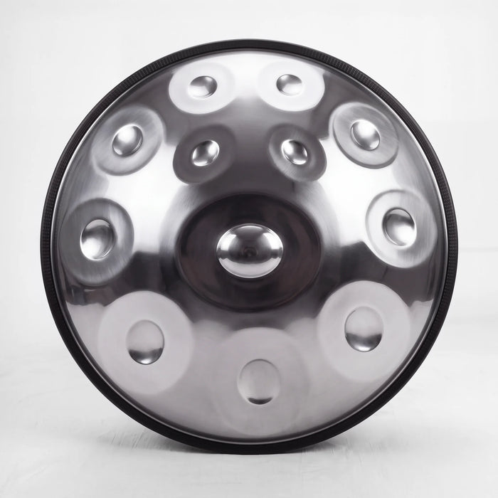 Front view of a Sonant D Kurd handpan with 12 notes in a silver finish, showing its central dome and 11 tone fields