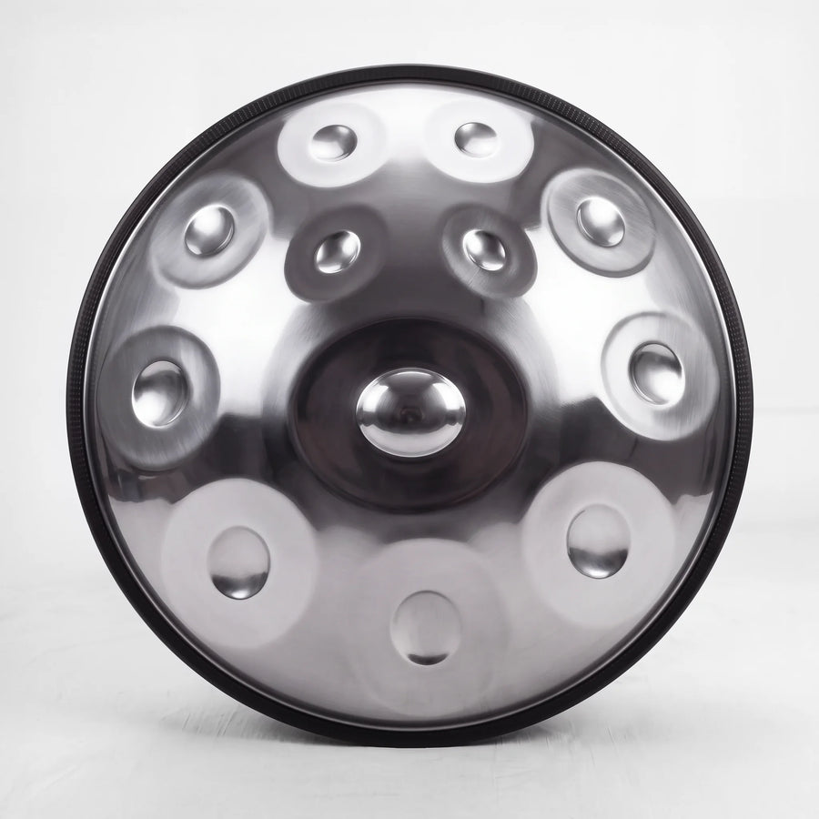 Front view of a Sonant D Kurd handpan with 12 notes in a silver finish, showing its central dome and 11 tone fields — 7