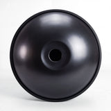 Underside of a Sonant D Kurd handpan with 9 notes in a black finish, showing its central opening and rim — 4