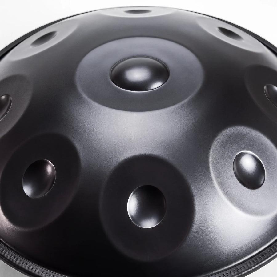 Close view of the central ding on a Sonant D Kurd handpan with 9 notes in a black finish — 5