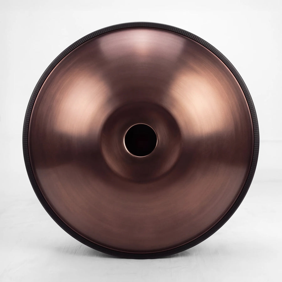 Underside of a Sonant D Kurd handpan with 9 notes in a bronze finish, showing its central opening and rim — 16
