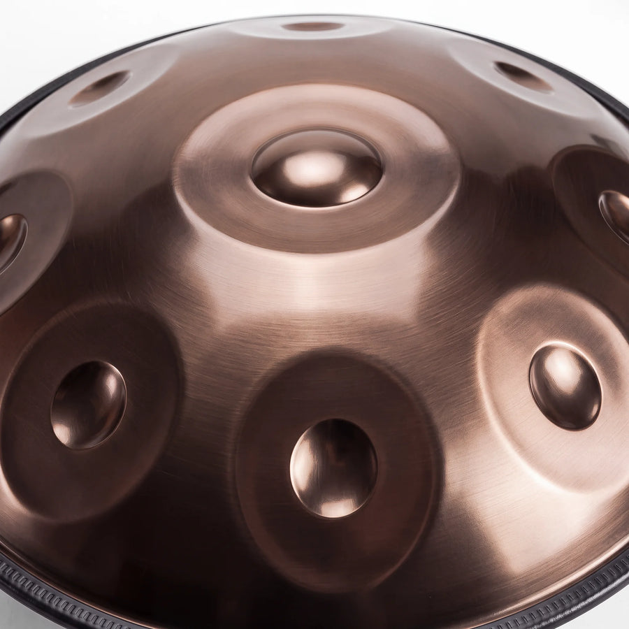 Close view of the central ding on a Sonant D Kurd handpan with 9 notes in a bronze finish — 17