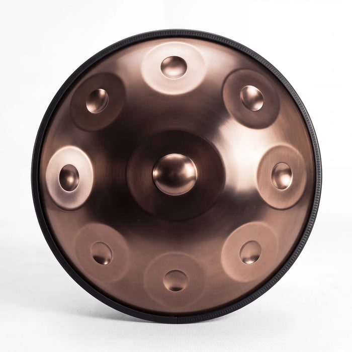 Front view of a Sonant D Kurd handpan with 9 notes in a bronze finish, showing its central dome and 8 tone fields