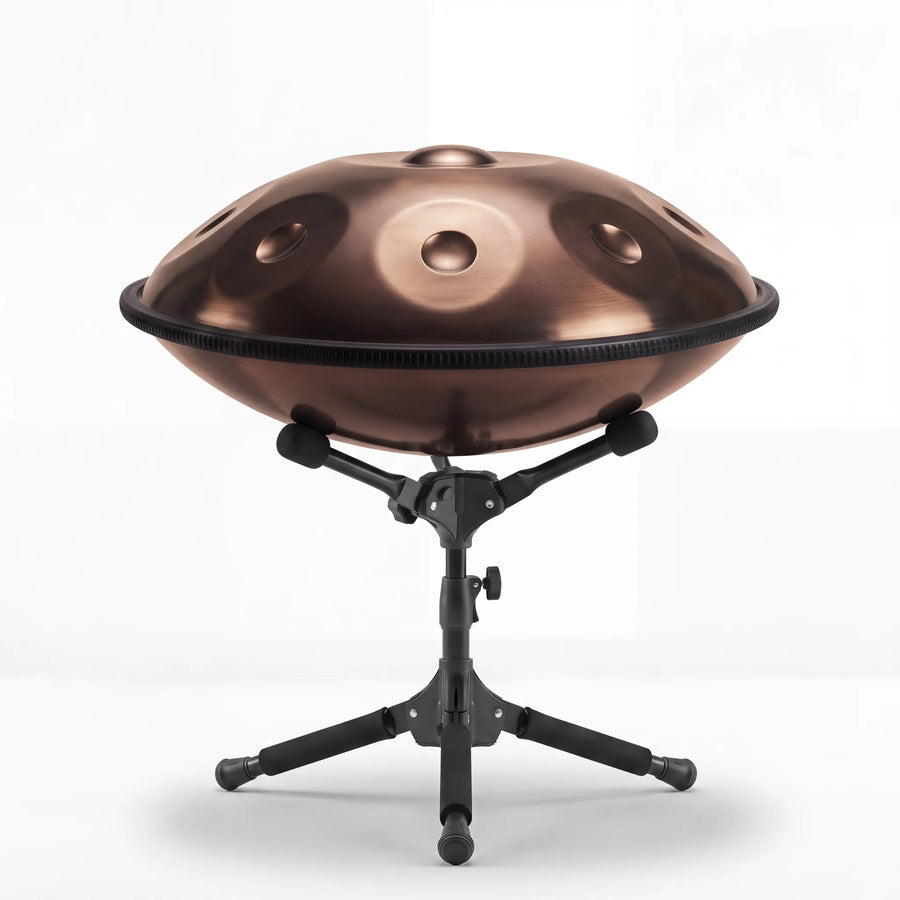 Sonant D Kurd handpan with 9 notes in a bronze finish on its folding stand — 18