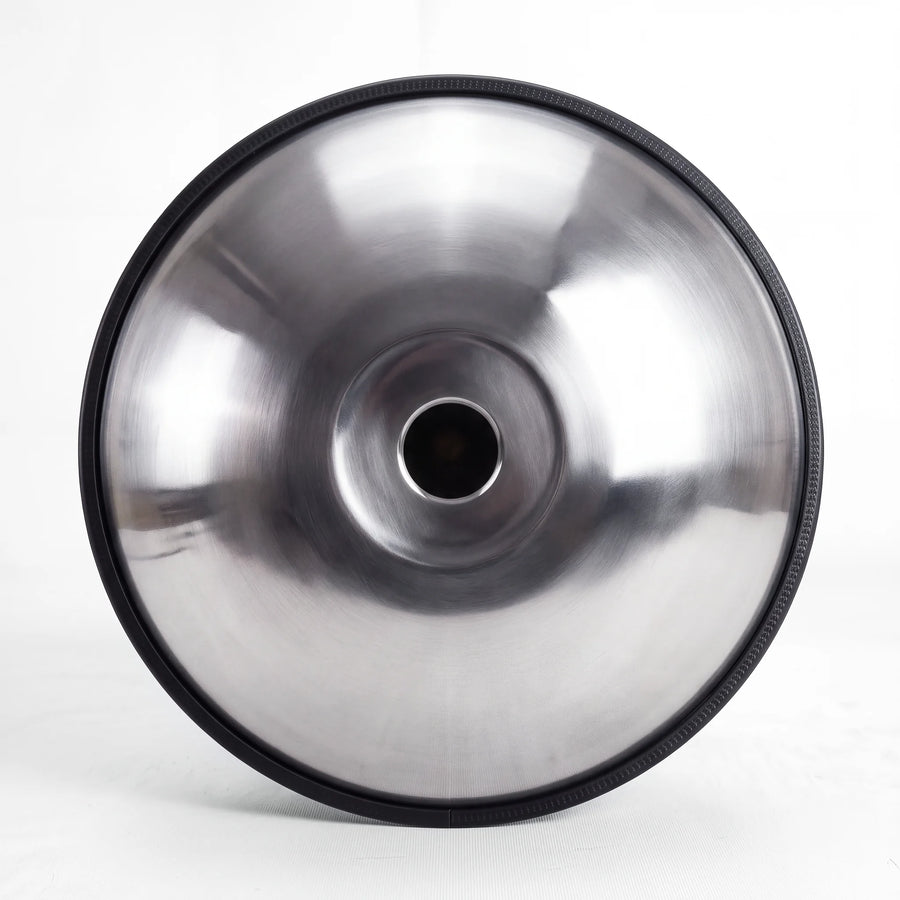 Underside of a Sonant D Kurd handpan with 9 notes in a silver finish, showing its central opening and rim — 10