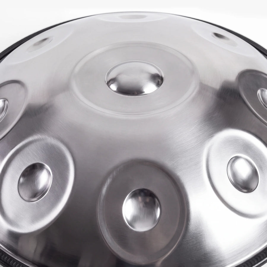Close view of the central ding on a Sonant D Kurd handpan with 9 notes in a silver finish — 11