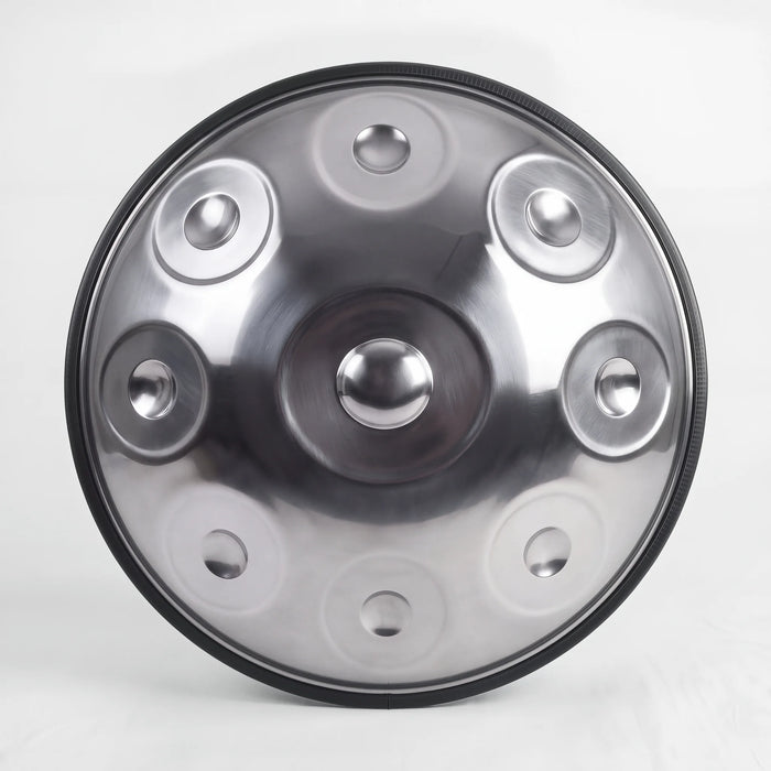 Front view of a Sonant D Kurd handpan with 9 notes in a silver finish, showing its central dome and 8 tone fields