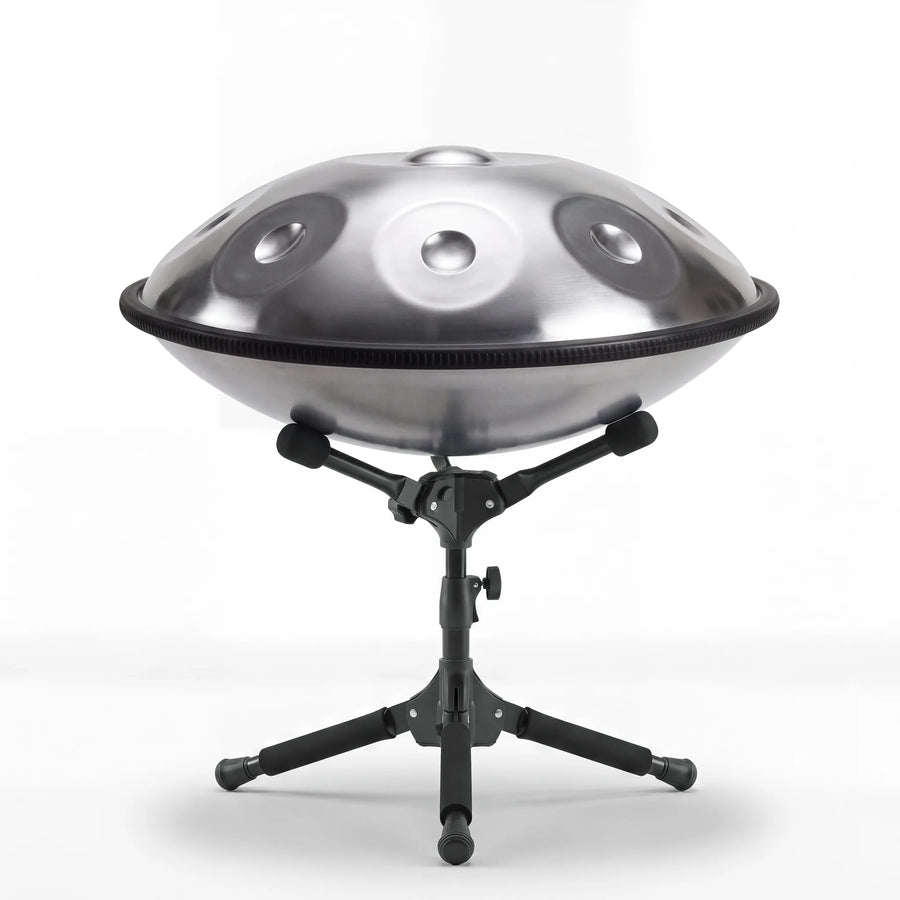 Sonant D Kurd handpan with 9 notes in a silver finish on its folding stand — 12
